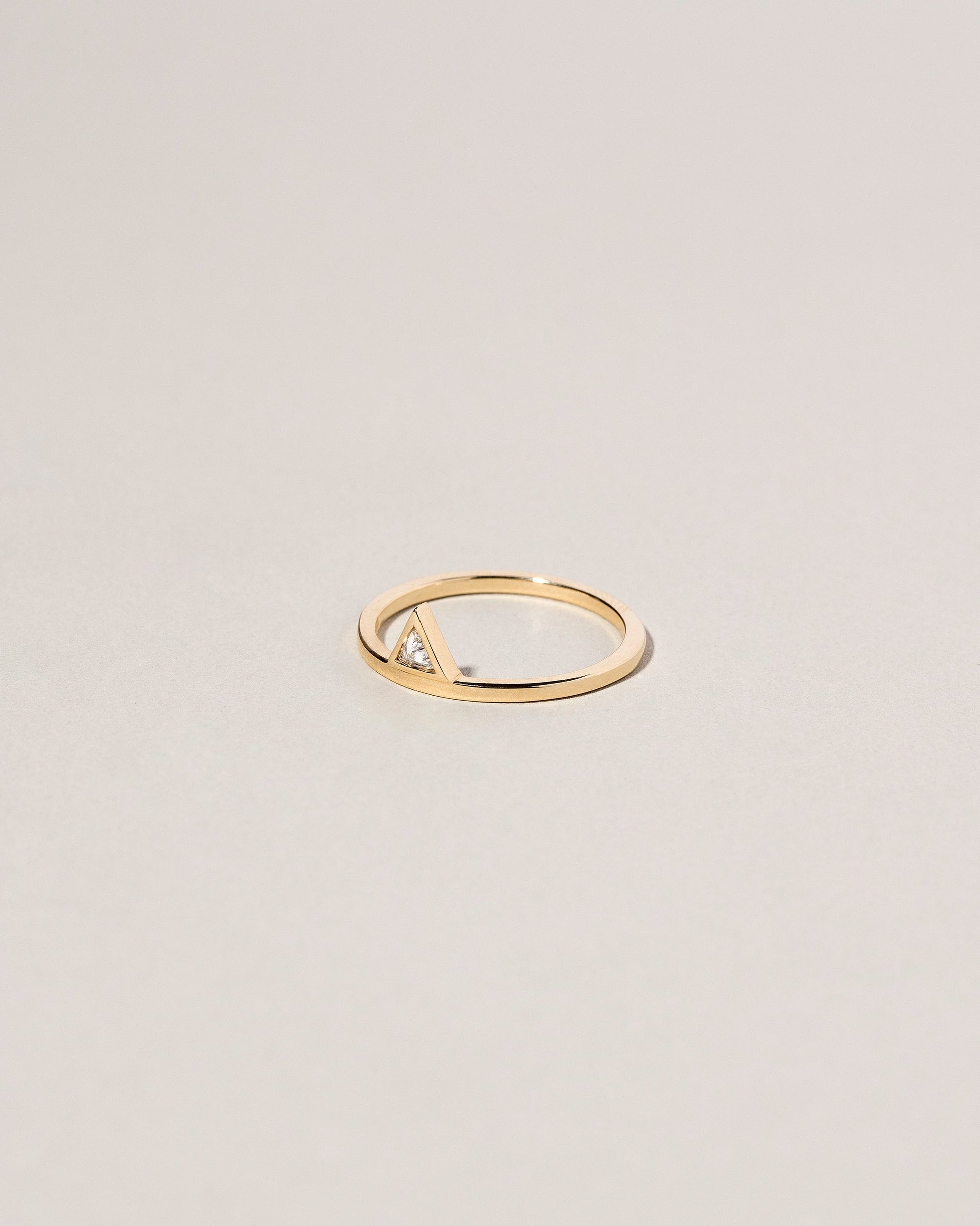 Stacked Ring - Triangle on light color background.