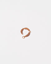 Sausage Links Charm on light color background.
