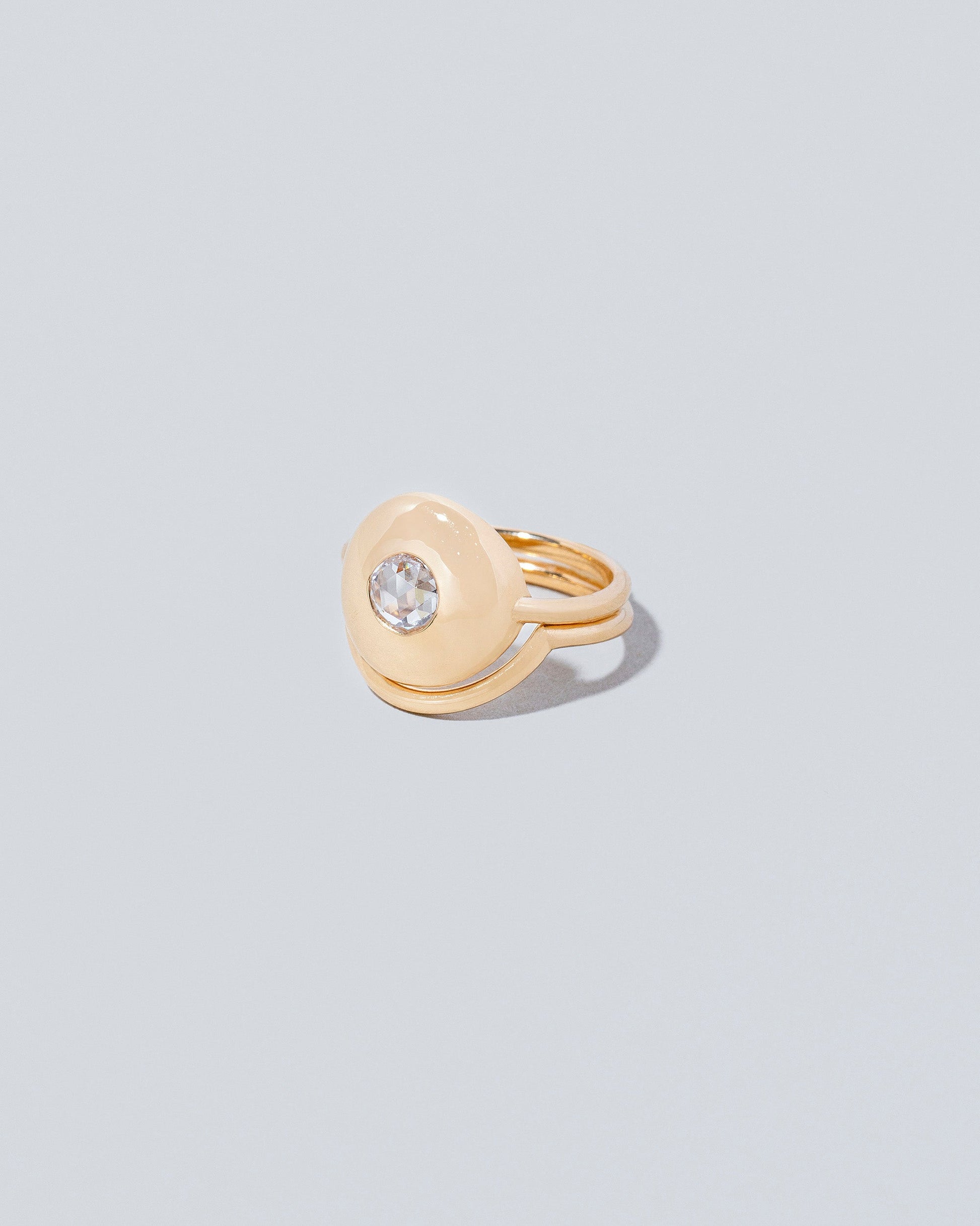 Petite Exposition Ring with Exposition Band on light colored background.