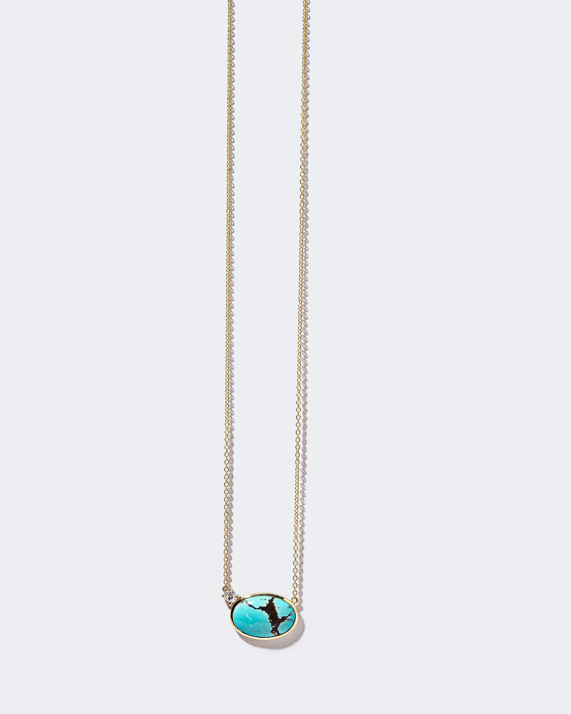 In-Between Necklace on light color background.