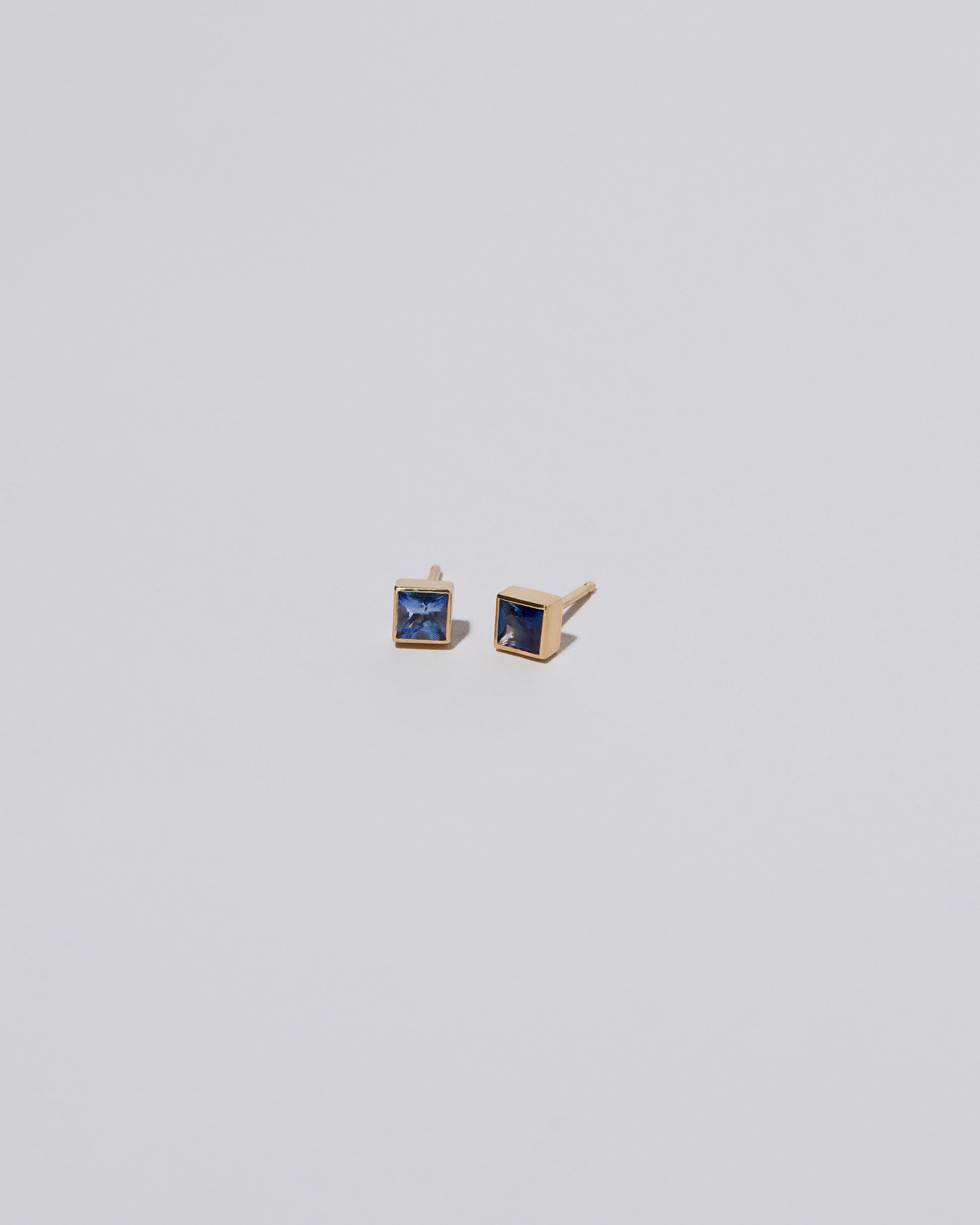 Square Stud - Blue Sapphire on light color background.
