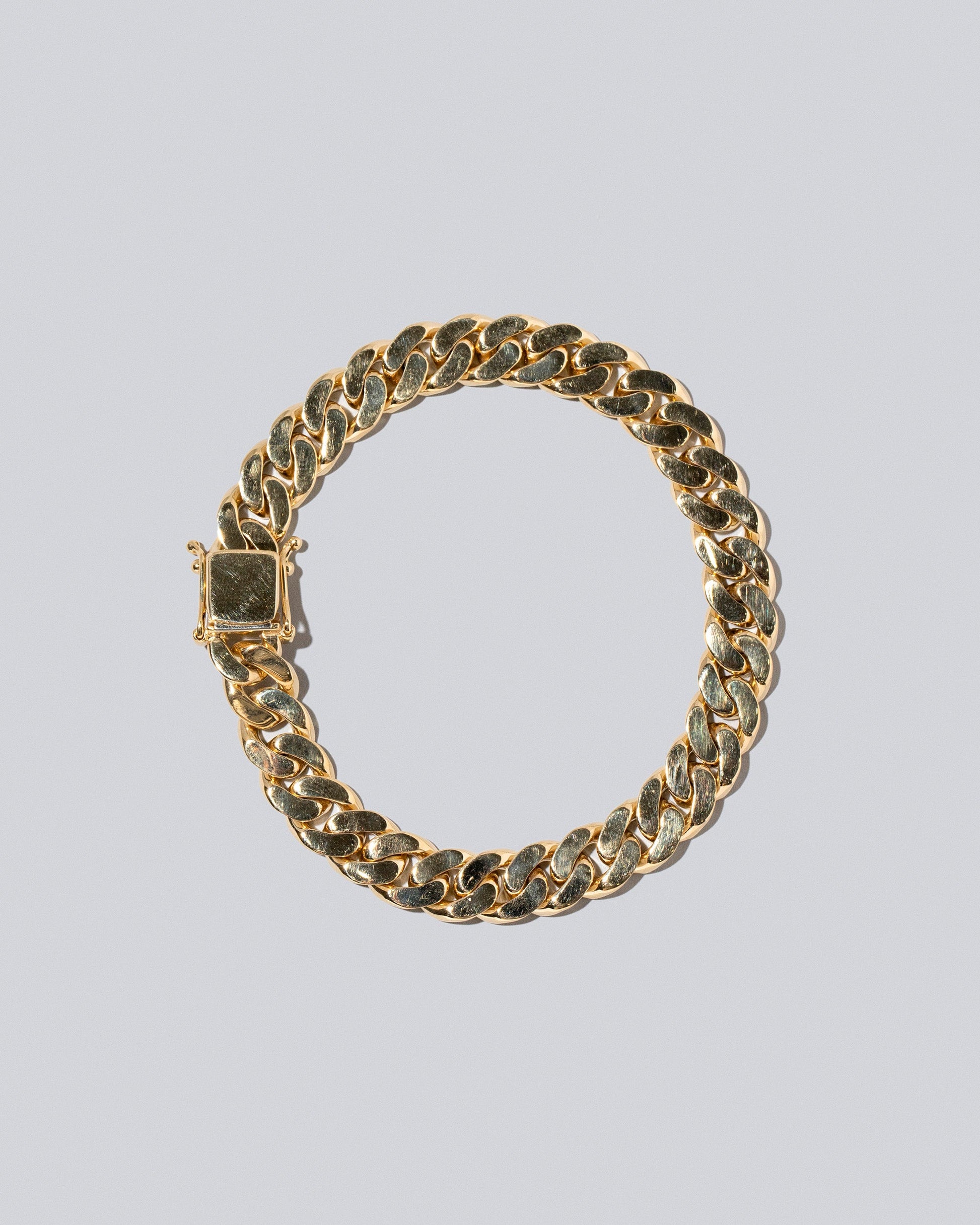 9.5mm Curb Chain Bracelet on light color background.