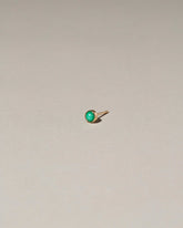 Birthstone Single Stud on light color background.