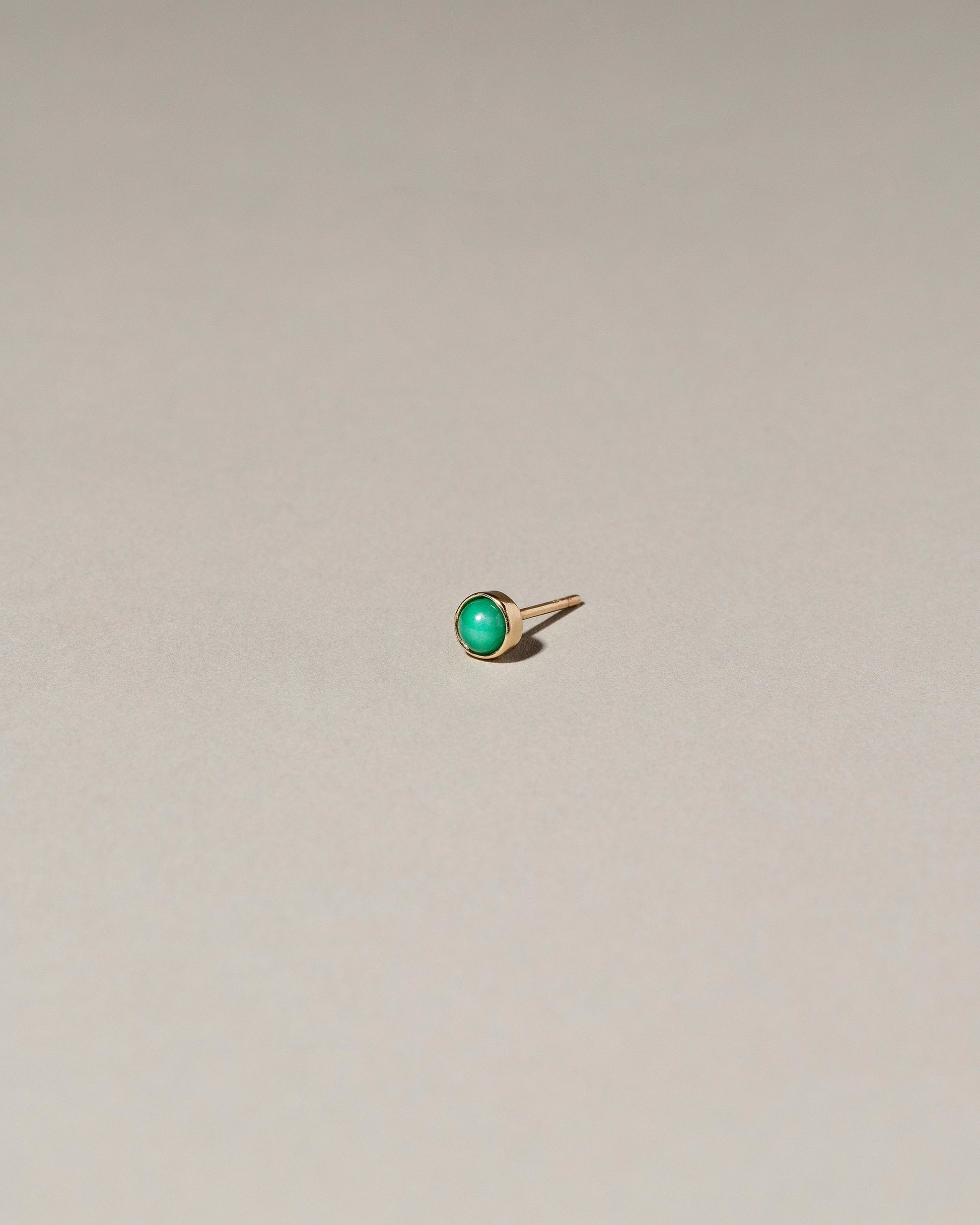  Birthstone Single Stud on light color background.