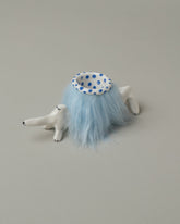 Closeup detail of the Eleonor Boström Blue Furry Baggage Dog on light color background.