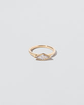 Atomism Ring on light color background.