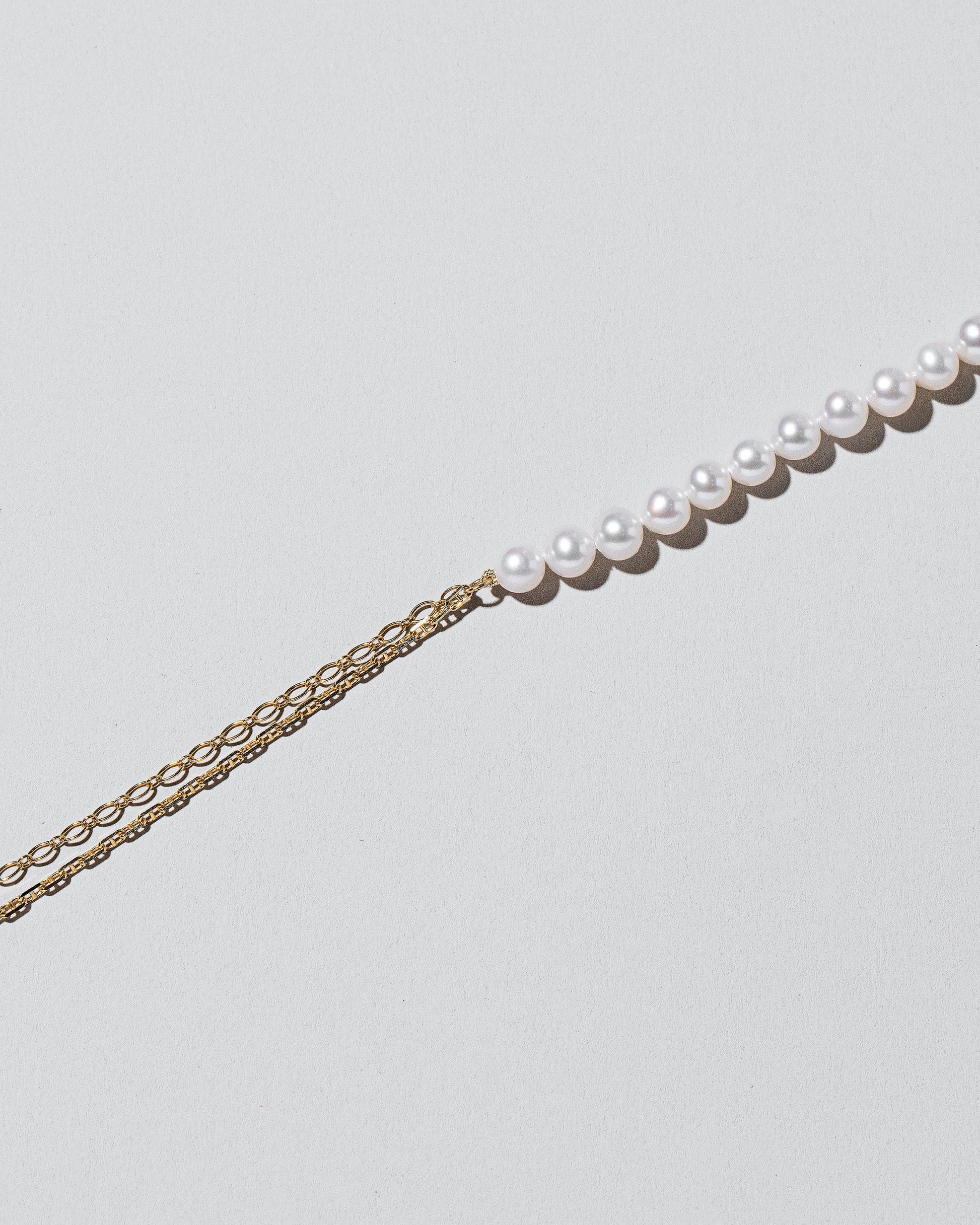 Pearls of Wisdom Necklace on light color background.