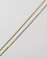  Petite Diamond Cut Chain Necklace on light color background.