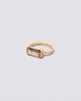 View from the side of the Book of Love Ring on light color background.