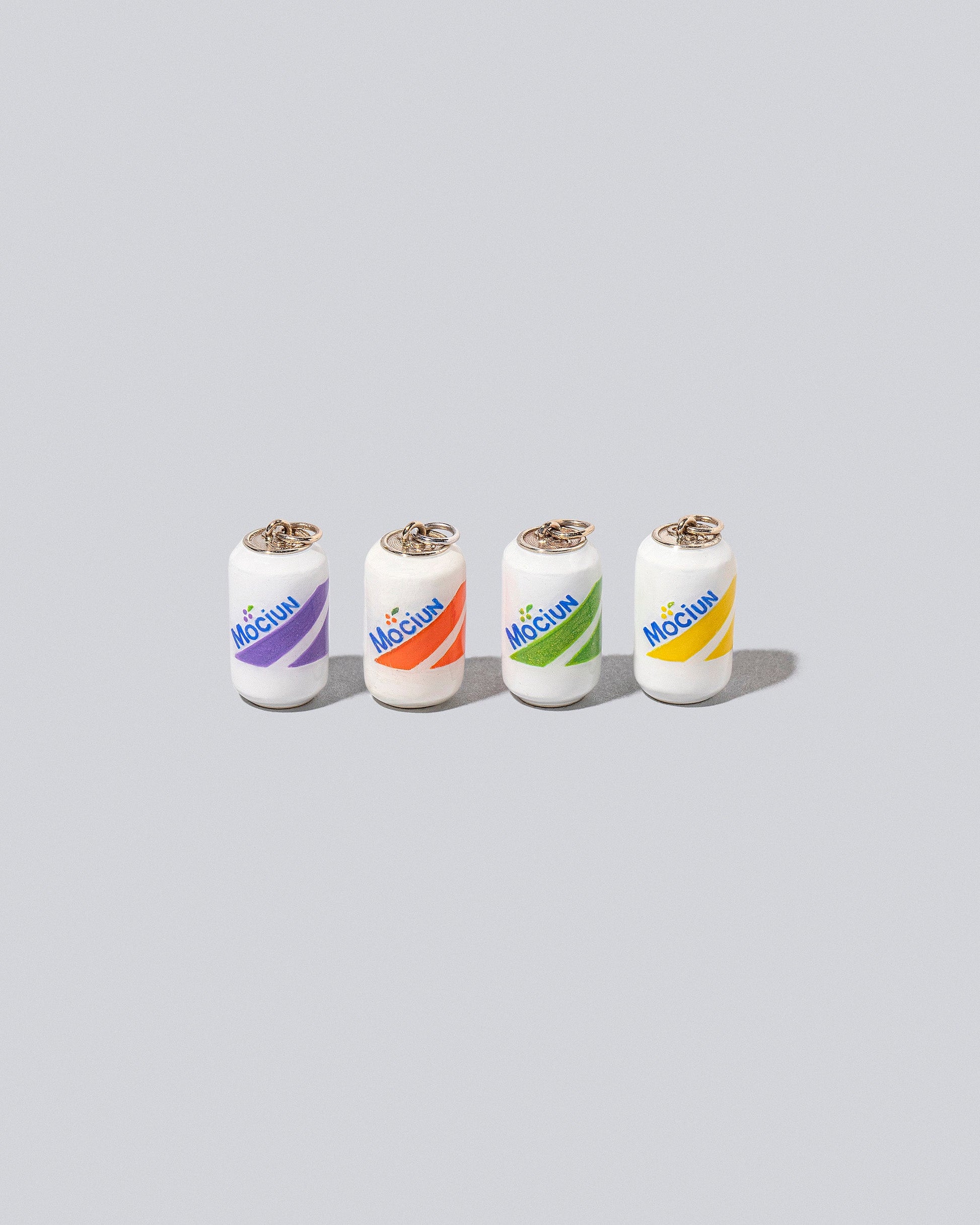 Mociun Soda Charms on light color background.