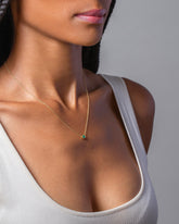 Emerald Sun & Moon Necklace on model.