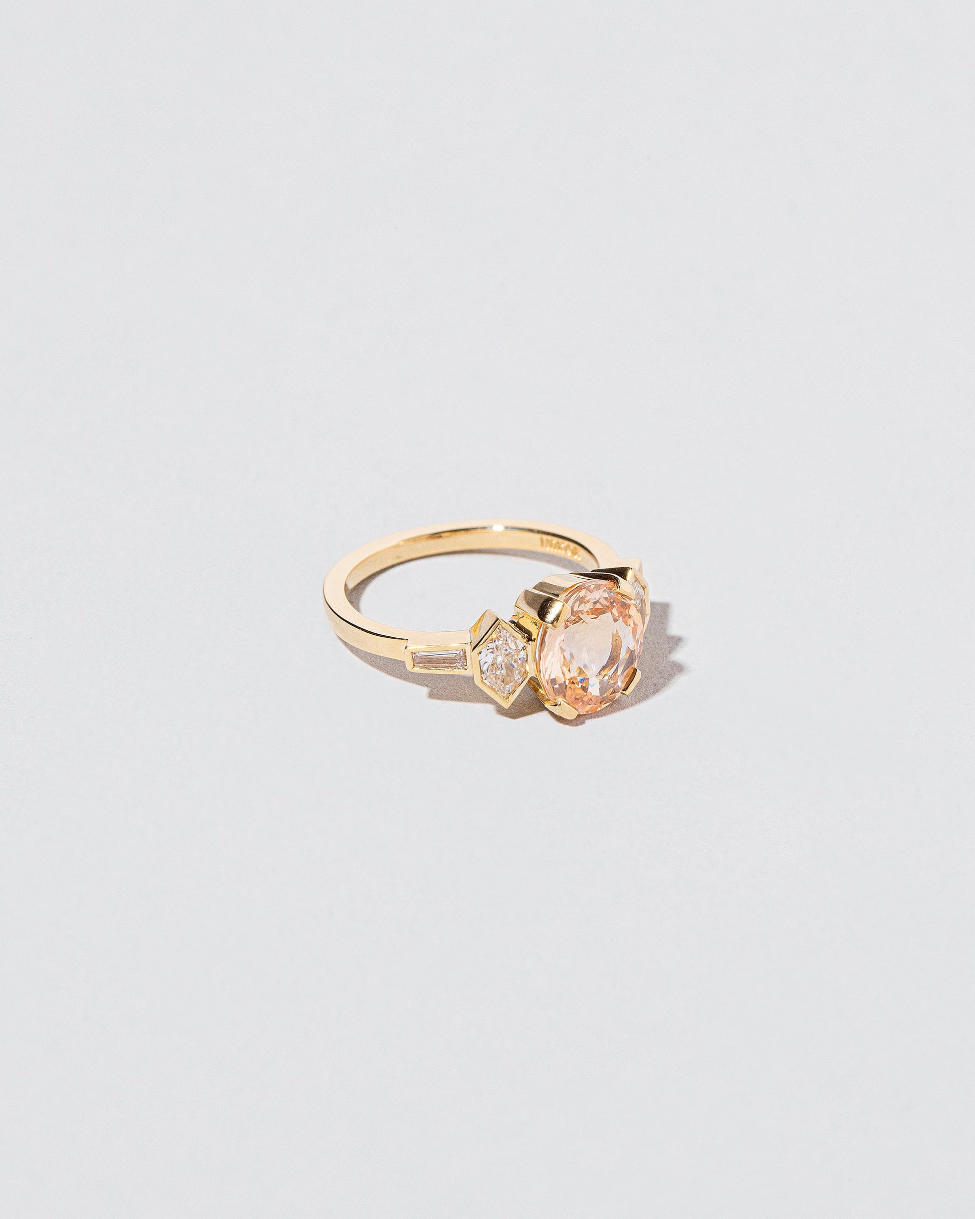 Qualia Ring on light color background.