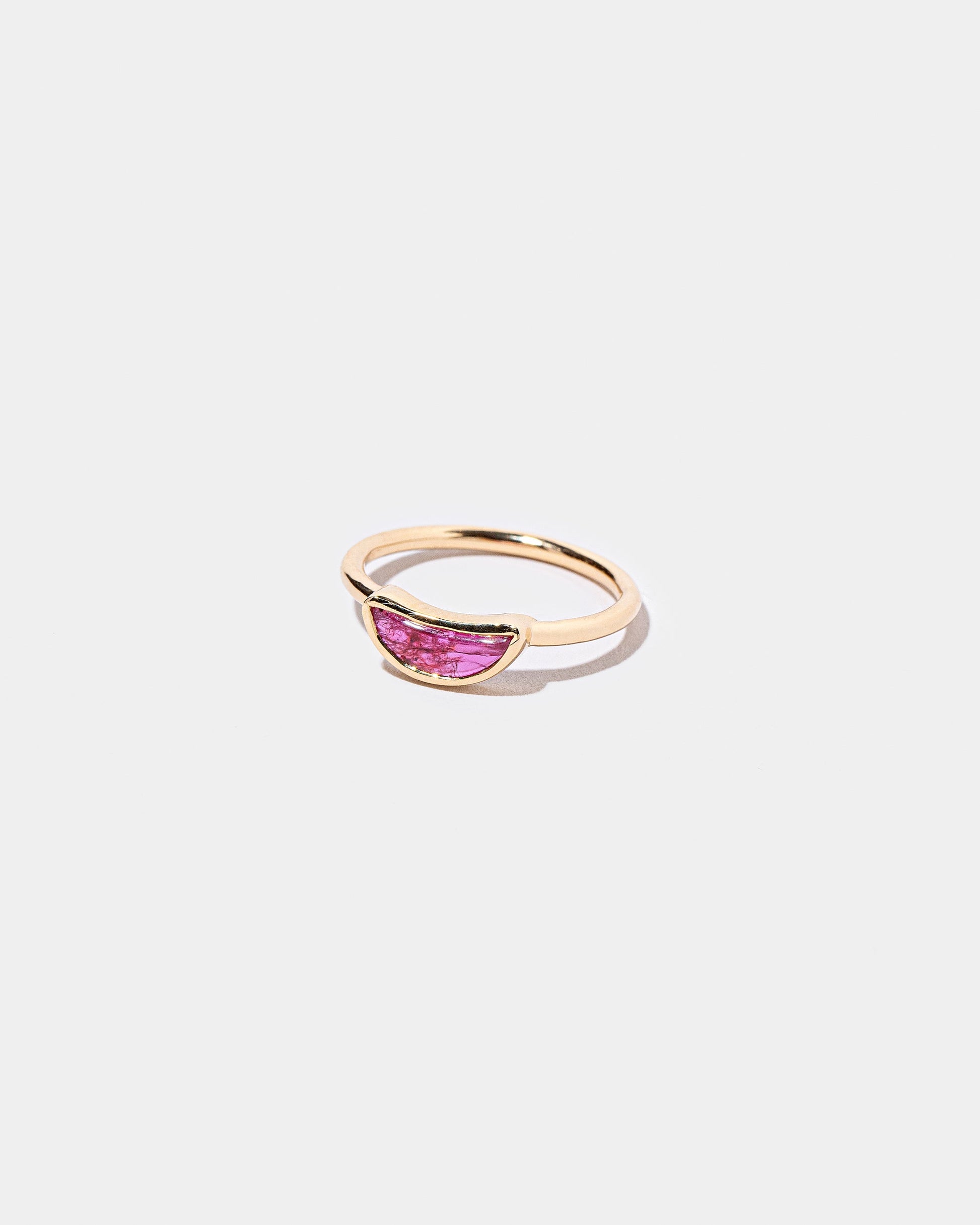 View from the side of the Passion Ring on light color background.