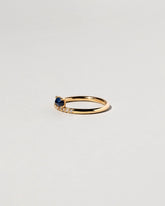 Stacked Ring - Sapphire & White Diamond on light color background.