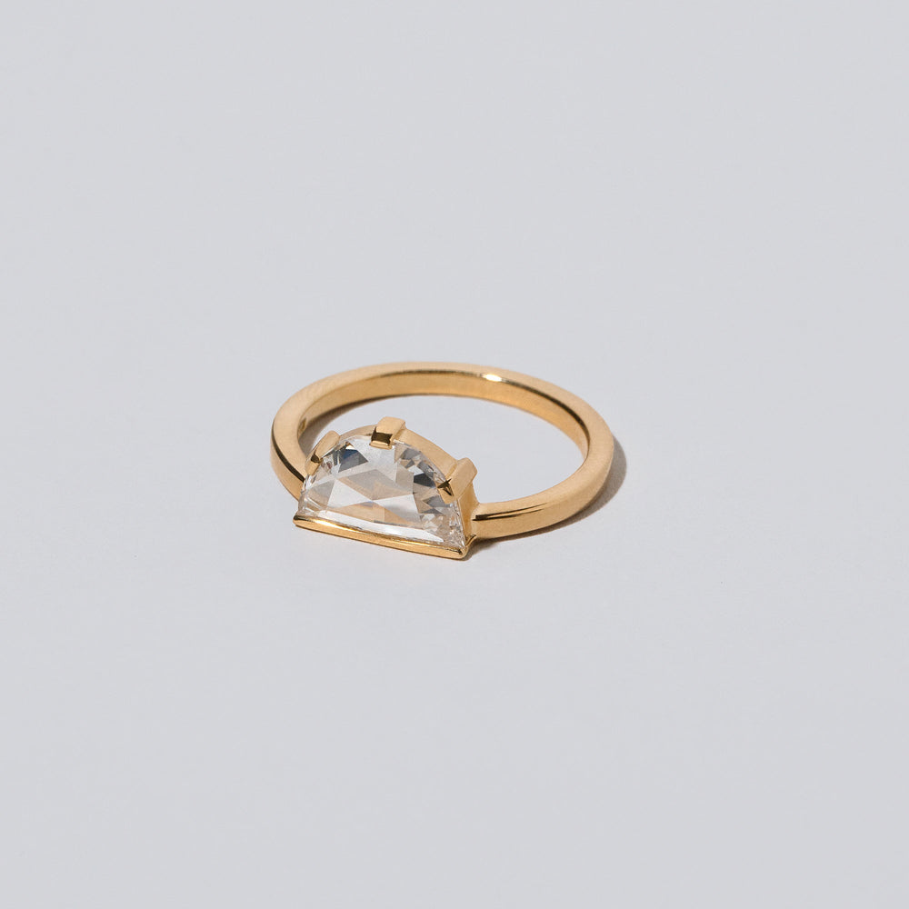product_details::Closeup details of the Plié Ring on light color background.