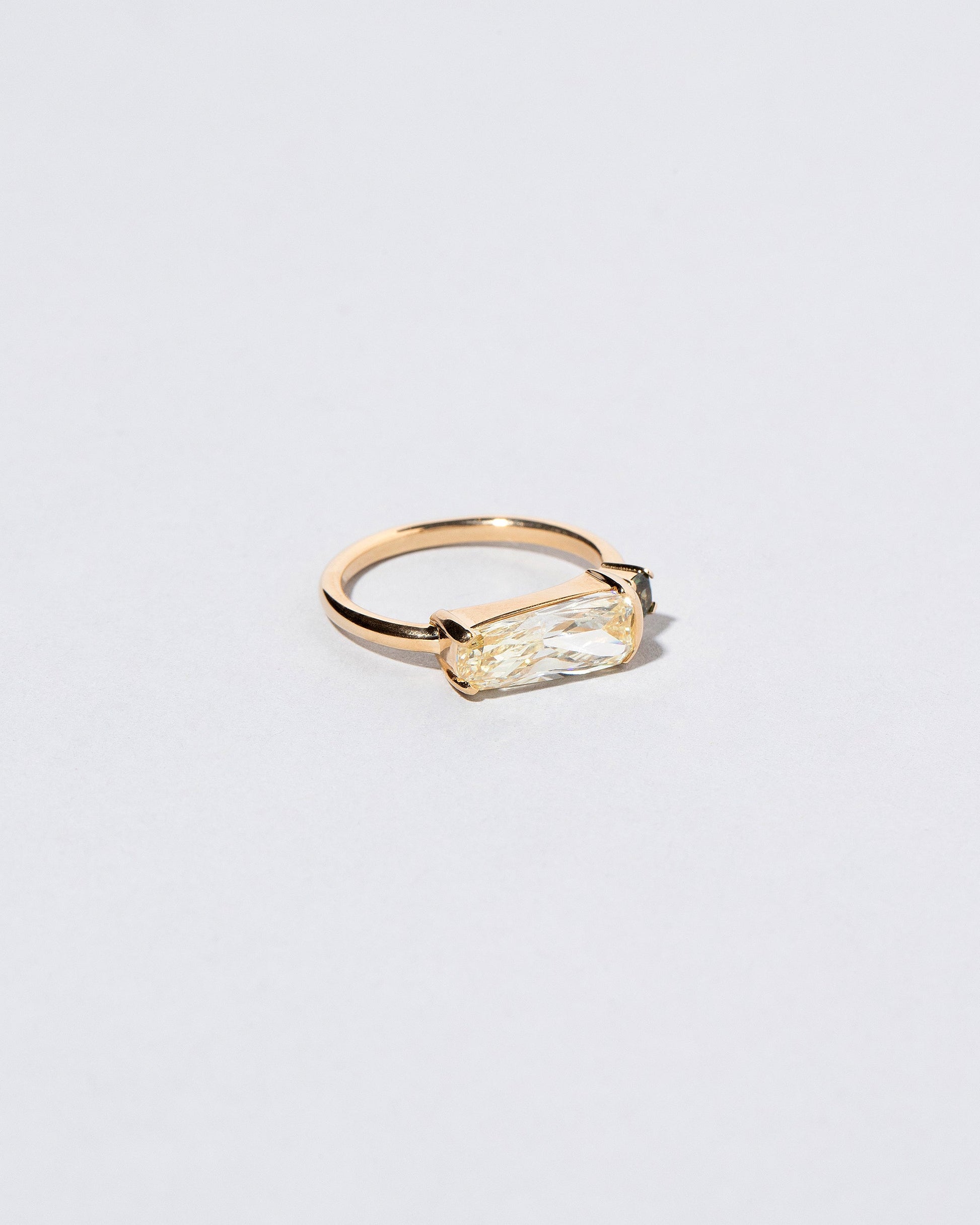 Immanence Ring on light color background.