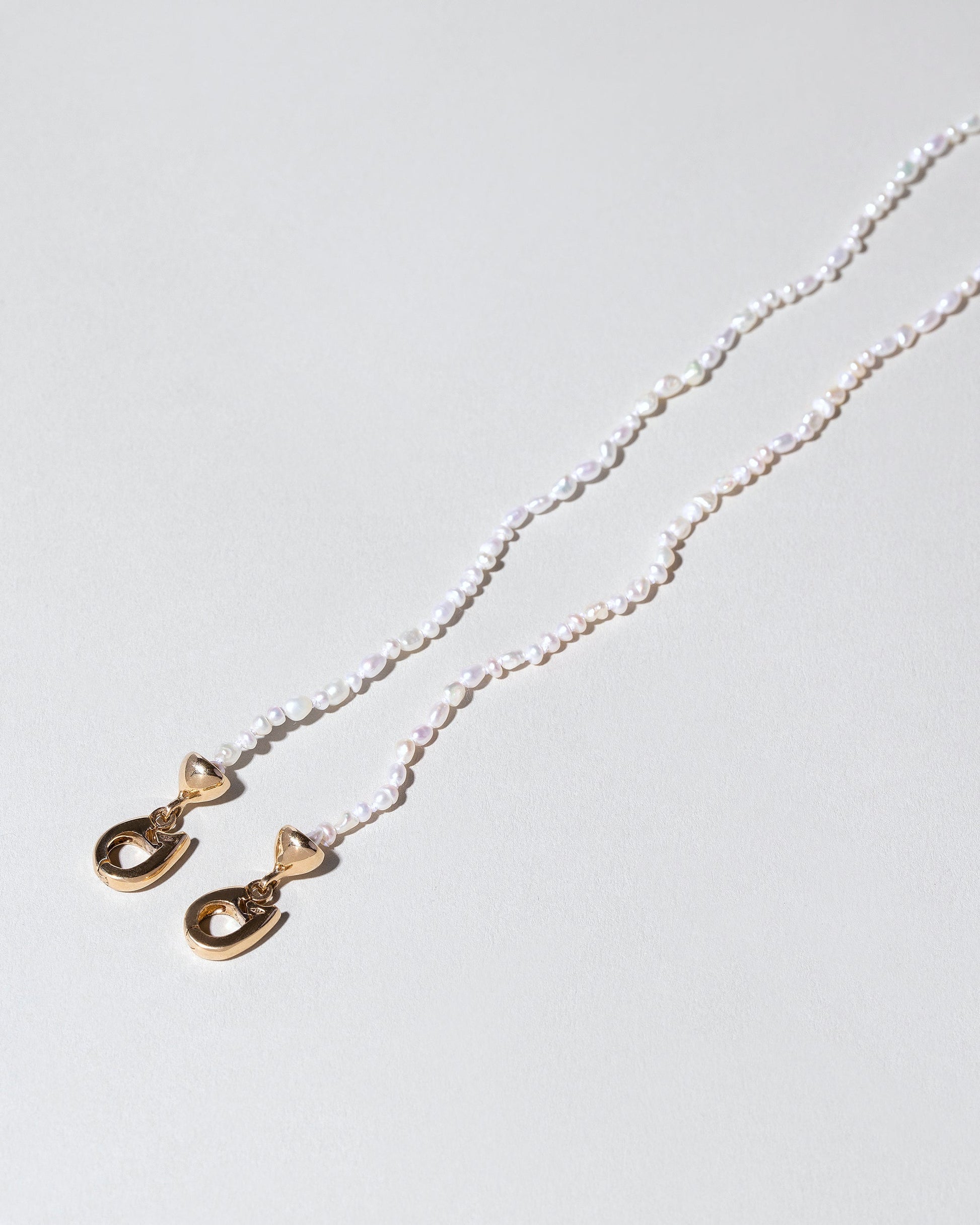 Convertible Optical Chain on light color background.