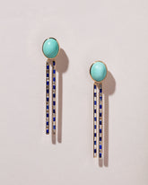 Spiritual Transformation Earrings on light color background.