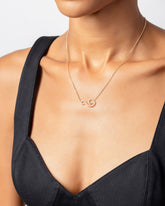 White Diamond Symbol of Change Necklace on model.