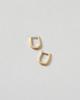 Poppy Flower Bud Hoops on light color background.