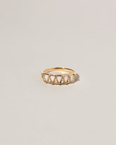 Five Triangle Ring - White Opal on light color background.