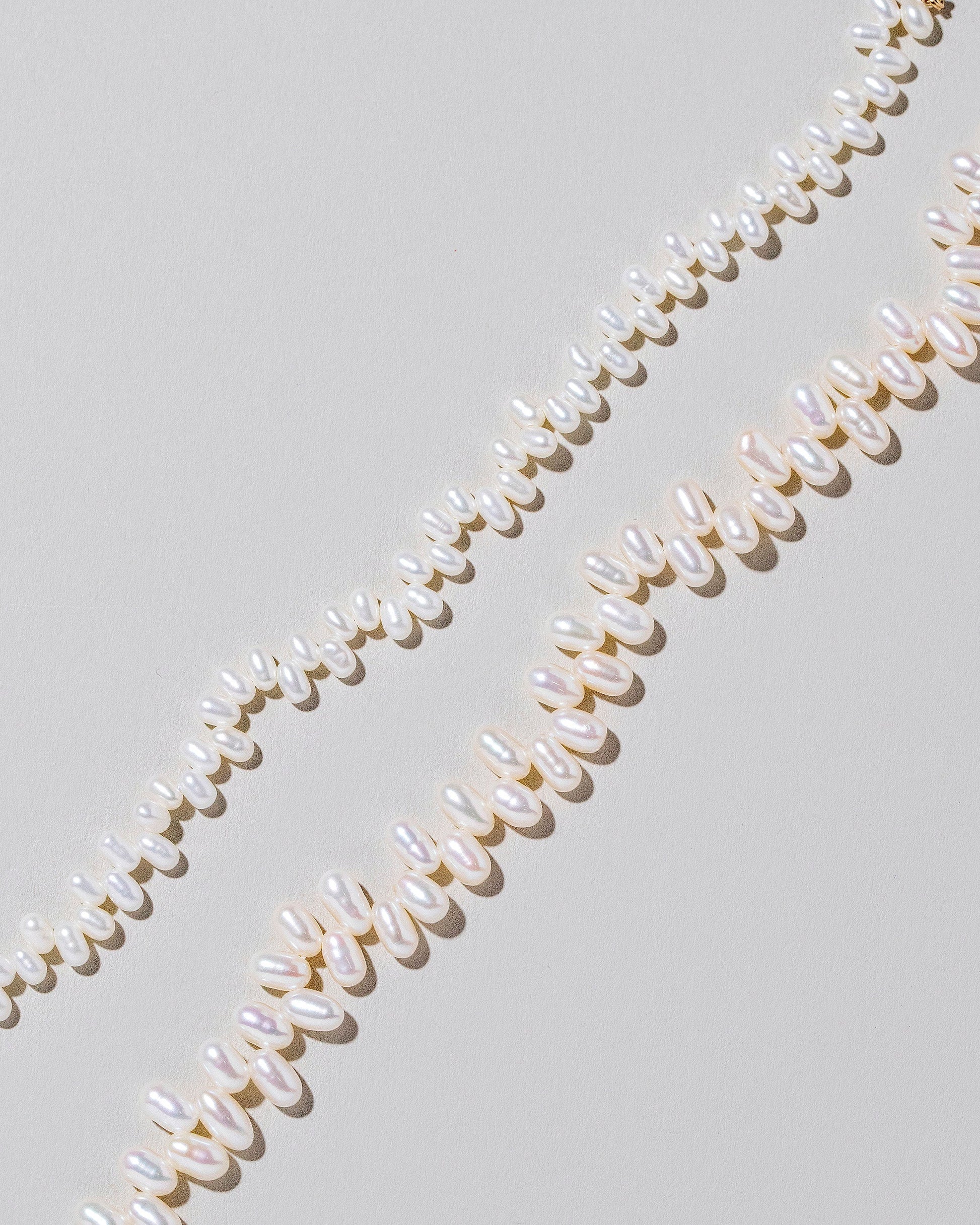 Zipper Pearl Bracelet on light color background.