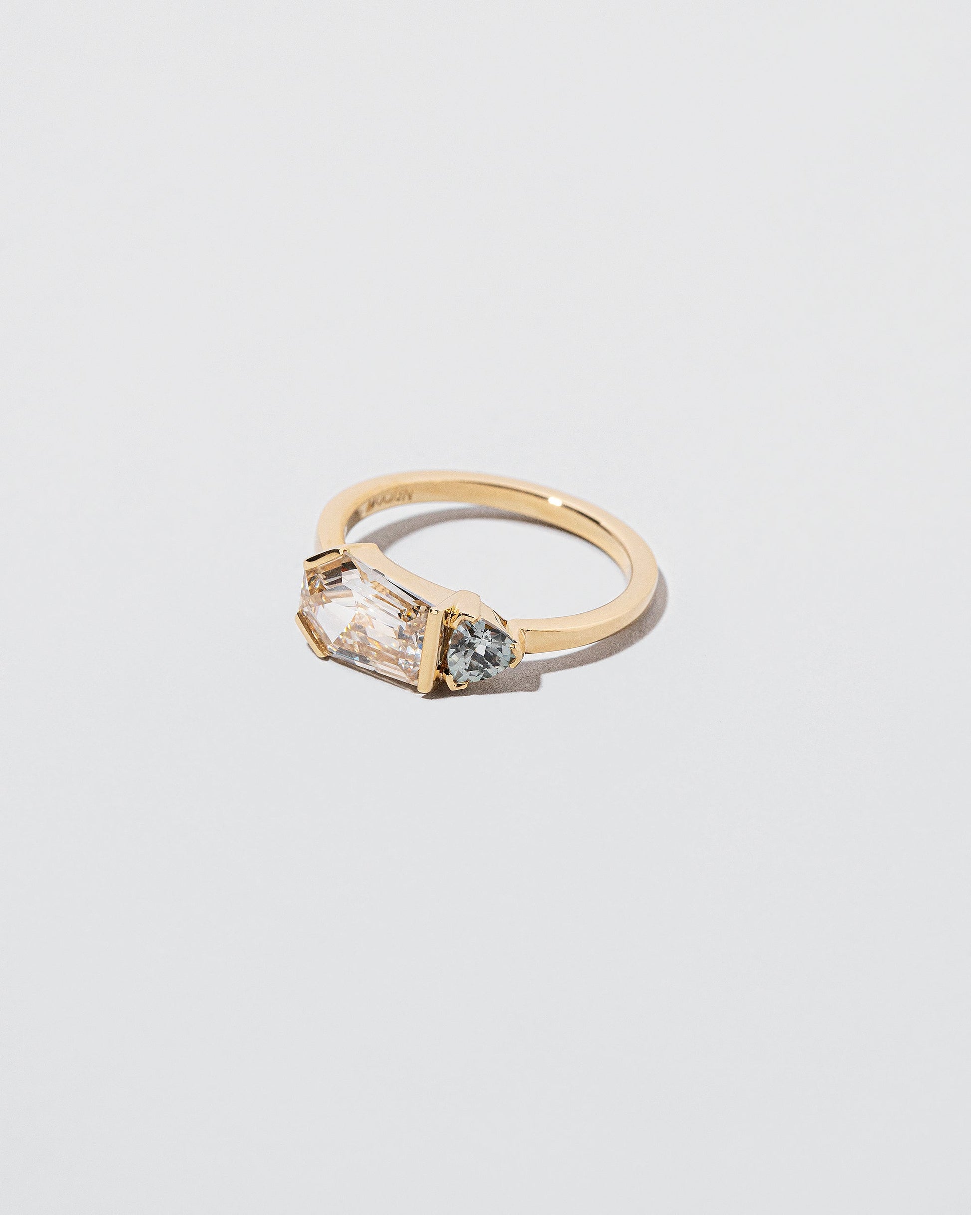 Pursuit Ring on light color background.