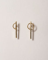 Stilt Dance Stud Earrings on light color background.