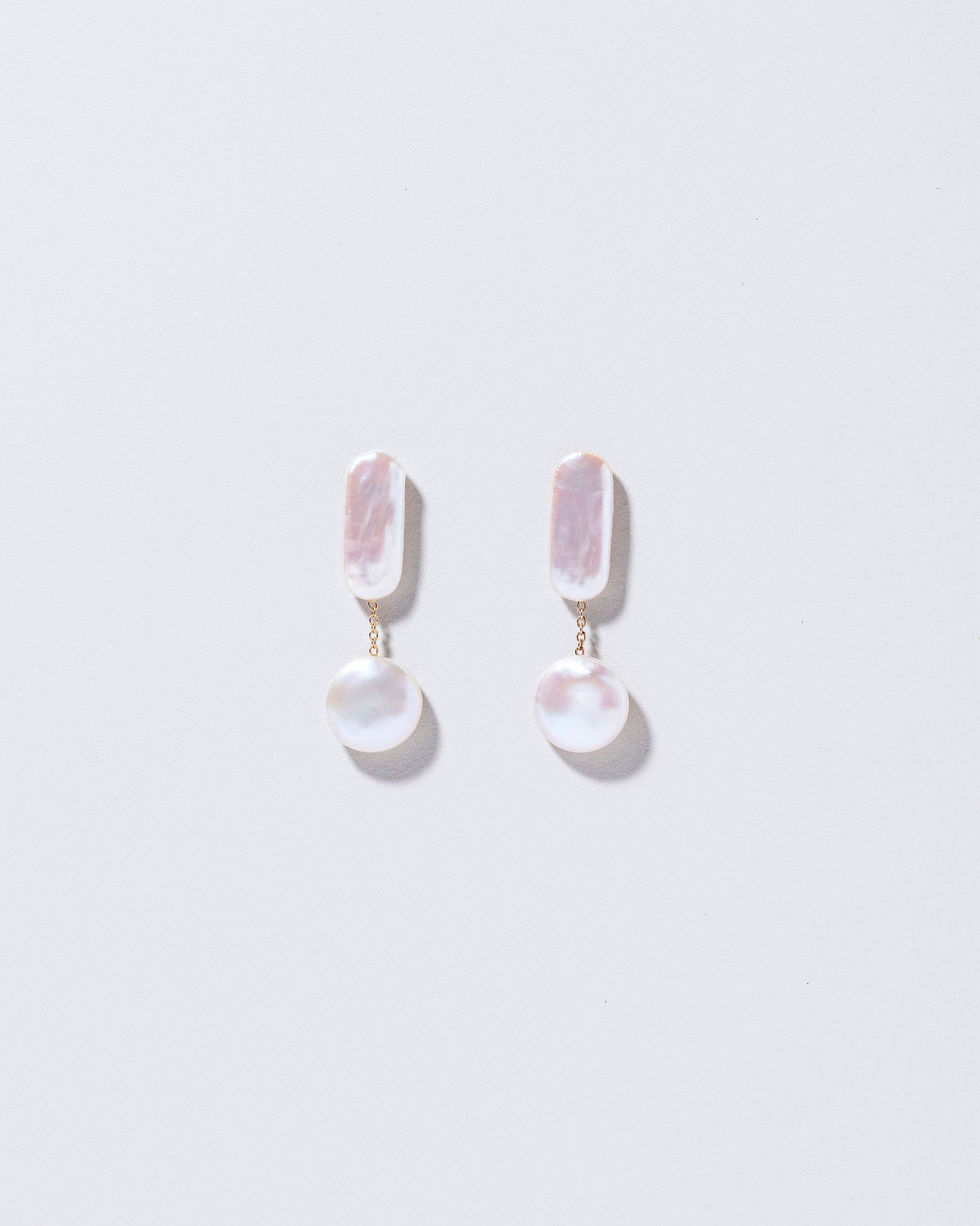 Polyphemus Earrings on light color background.