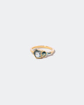Syncretism Ring on light color background.