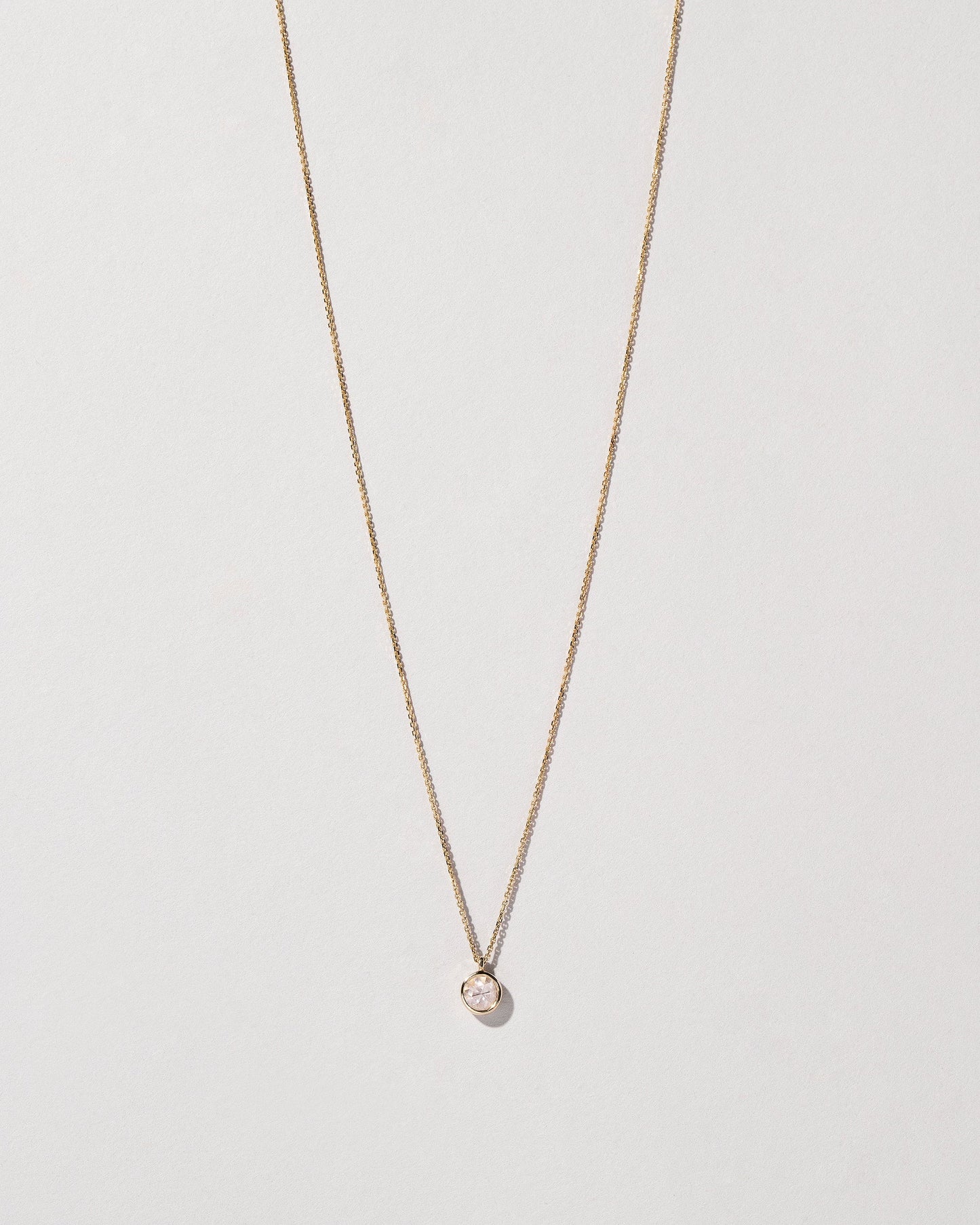 Birthstone Necklace on light color background.