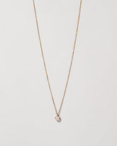 Birthstone Necklace on light color background.