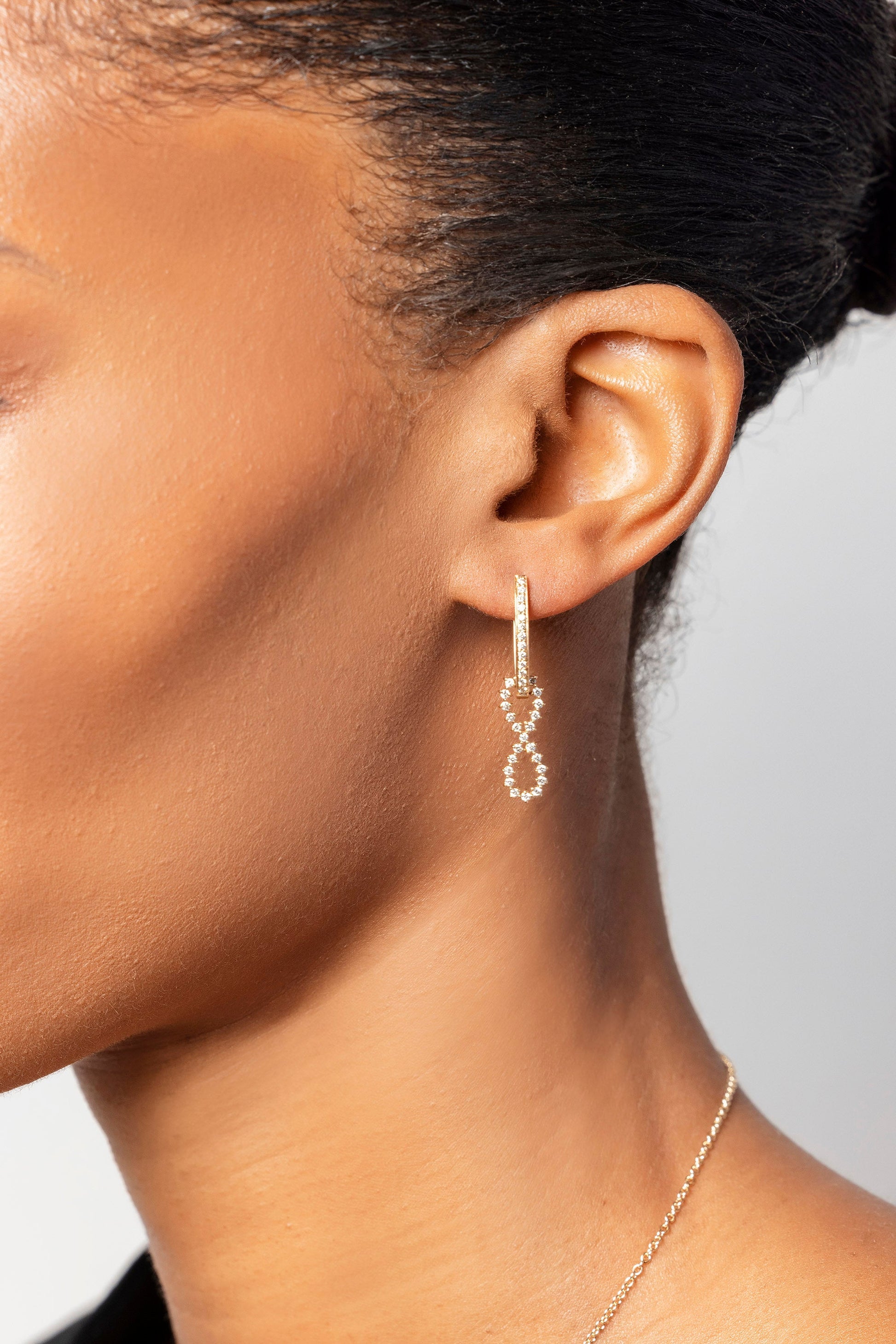 White Diamond Lifecycle Earrings on model.