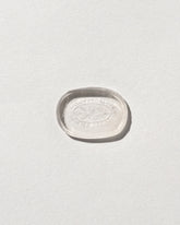 Strength Intaglio Seal on light color background.