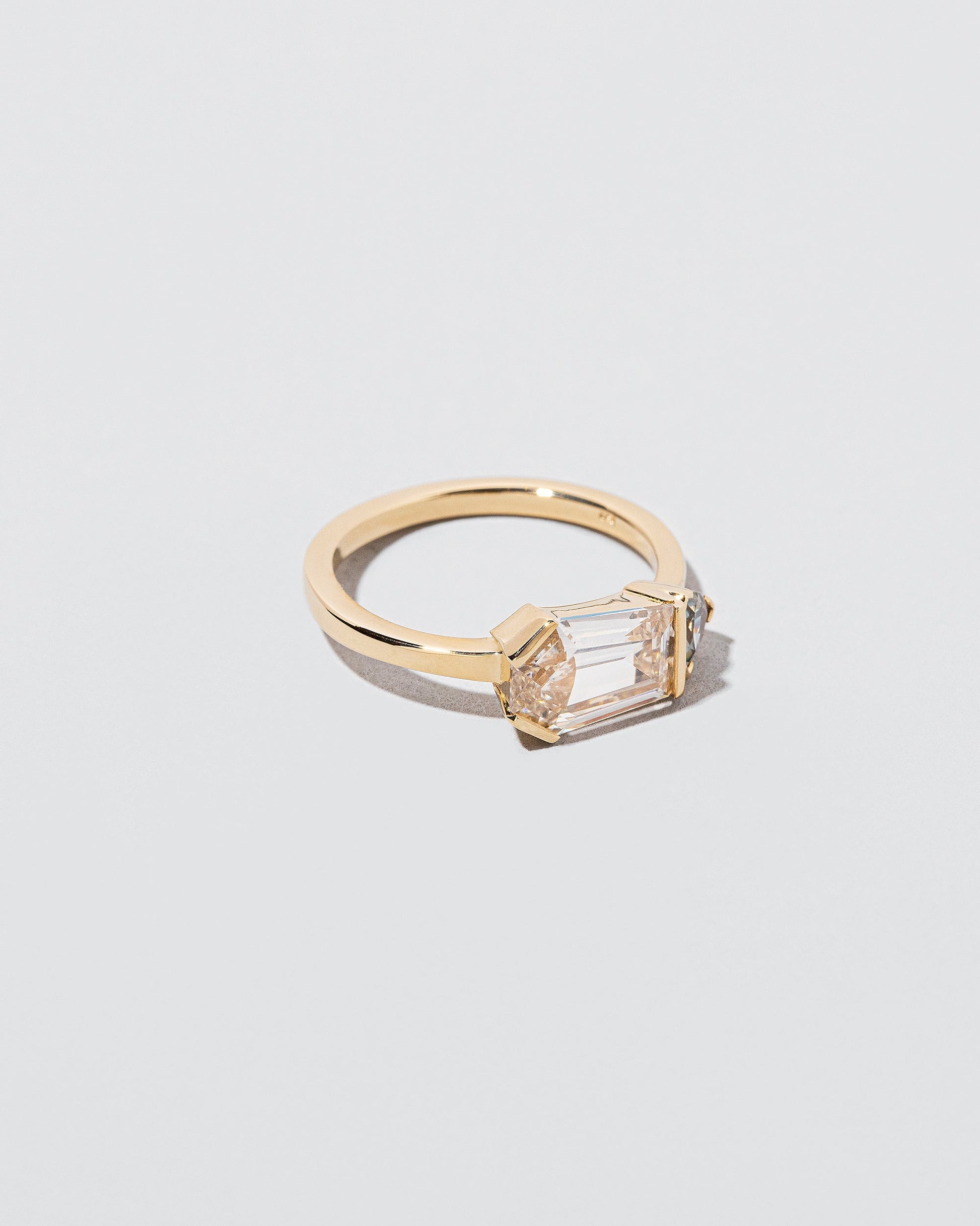 Pursuit Ring on light color background.