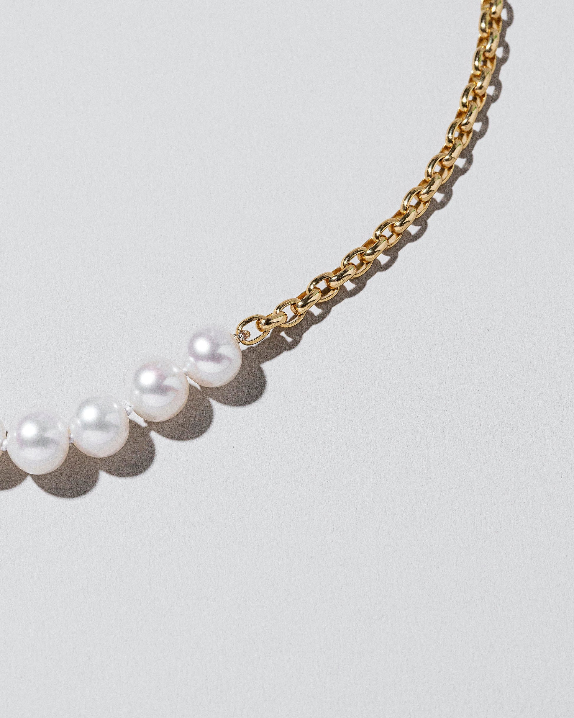 Pearls of Wisdom Necklace on light color background.