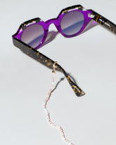 Convertible Optical Chain on light color background.