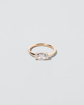 Elixer Ring on light color background.