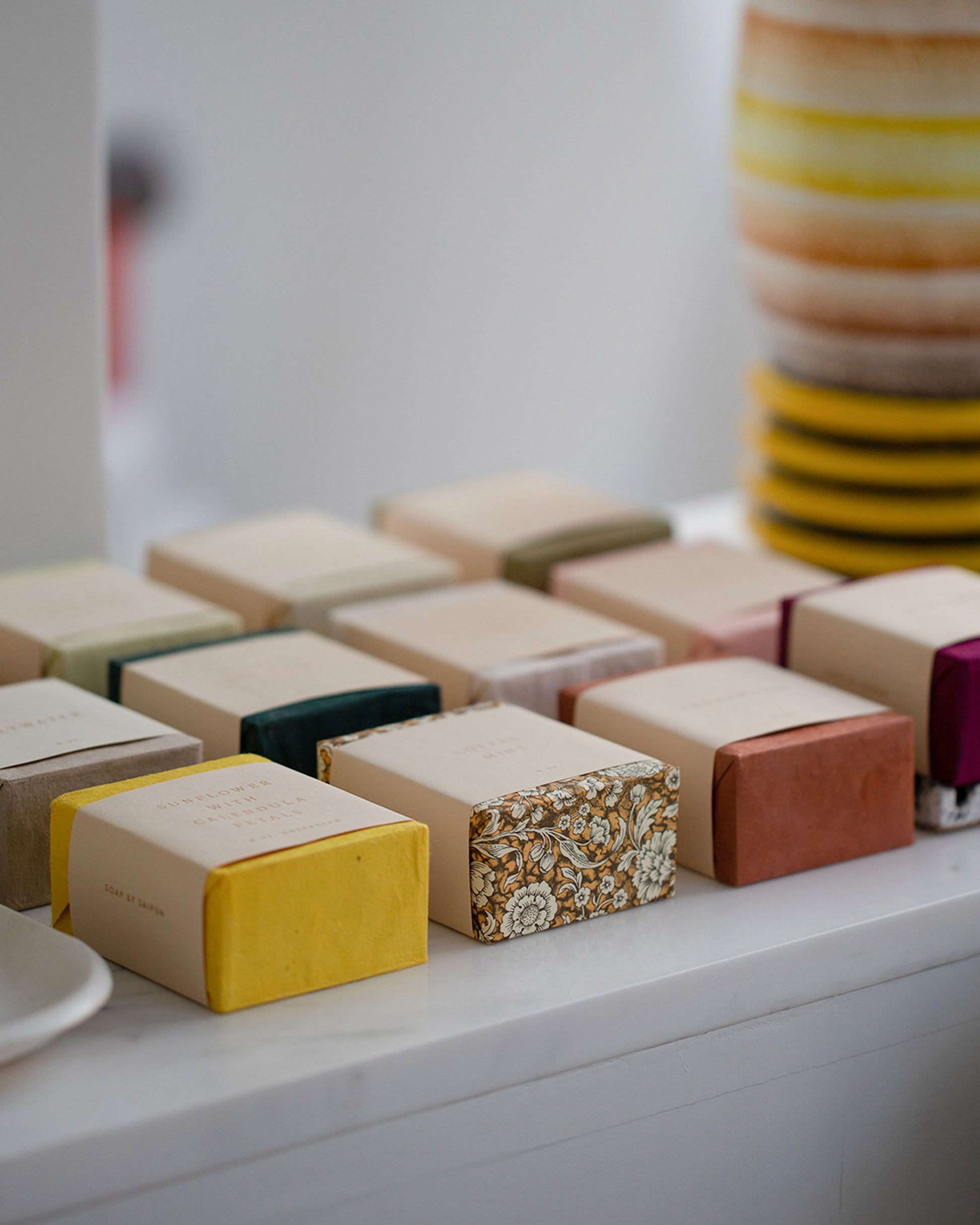 Styled image featuring a group of Saipua Soaps.