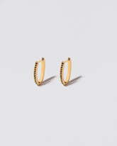 Tiny Loop Hoops on light colored background.