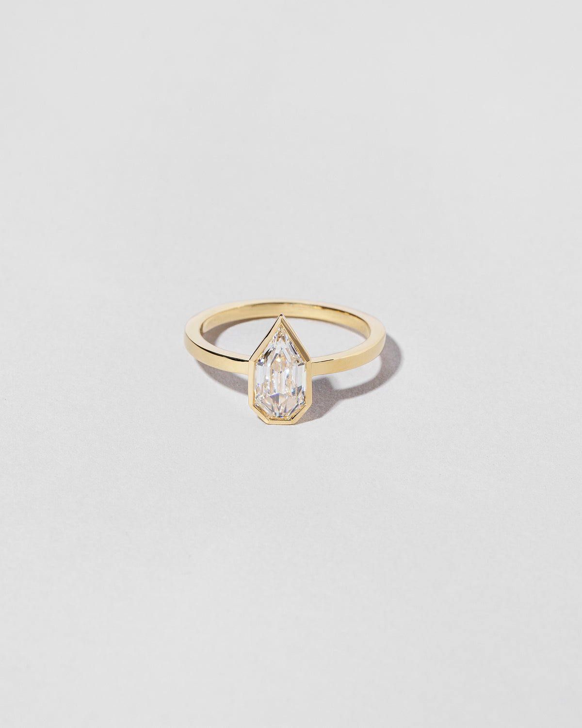 Modified Shield Step Cut Diamond Solitaire Ring front facing
