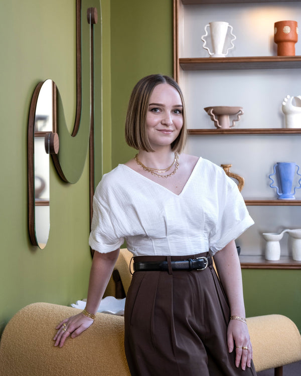 Mociun's Senior Fine Jewelry Specialist & Diamond, Jillian, seated in our fine jewelry showroom.