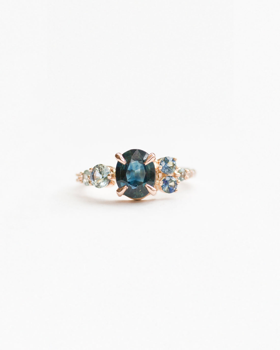 Sapphire and aqua stone cluster ring rose gold front view