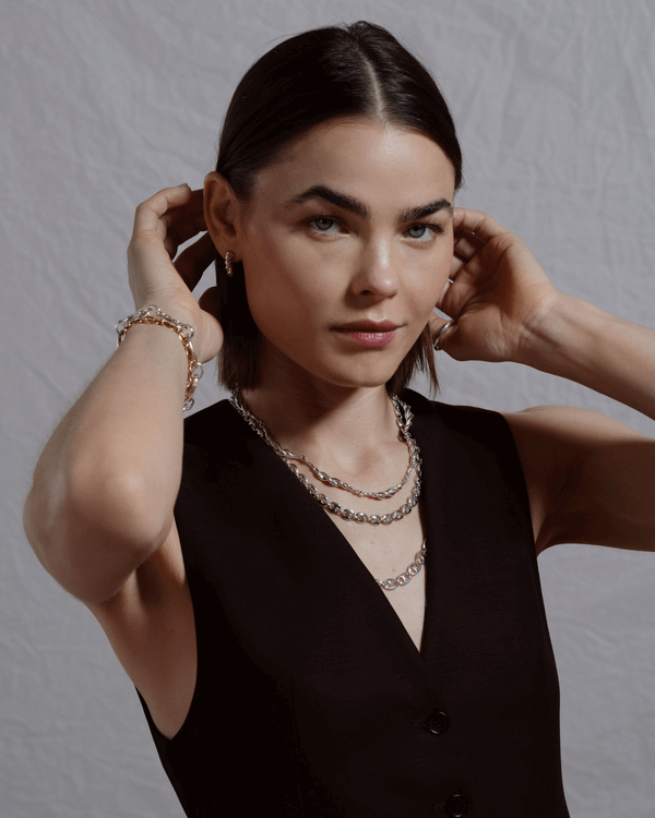 Editorial photo of model wearing silver jewelry from the CRZM by Mociun collection.