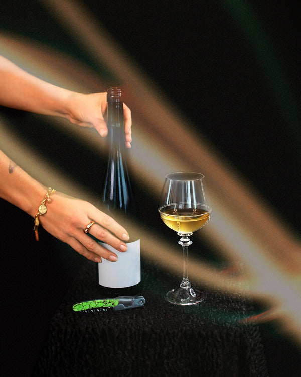 Styled long exposure image featuring the Santa Fe Stoneworks Neon Ranger Waiter's Knife on dark color background.