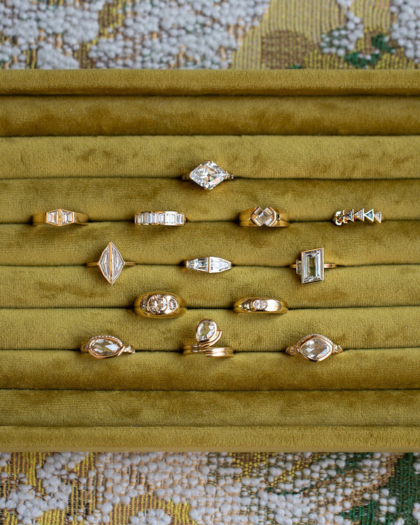 Collection & One-of-a-Kind Rings in Mociun's signature chartreuse velvet jewelry tray.