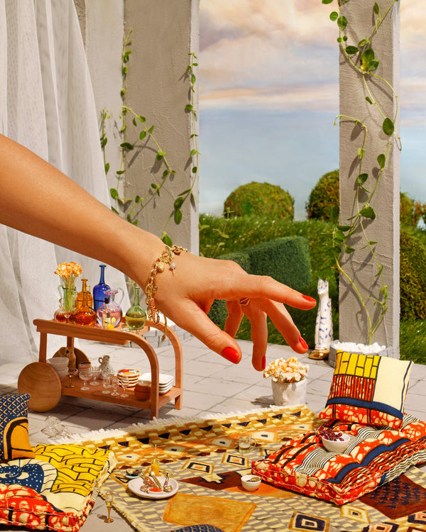 Styled image featuring Fine Foods Charms displayed in a miniature picnic setting.