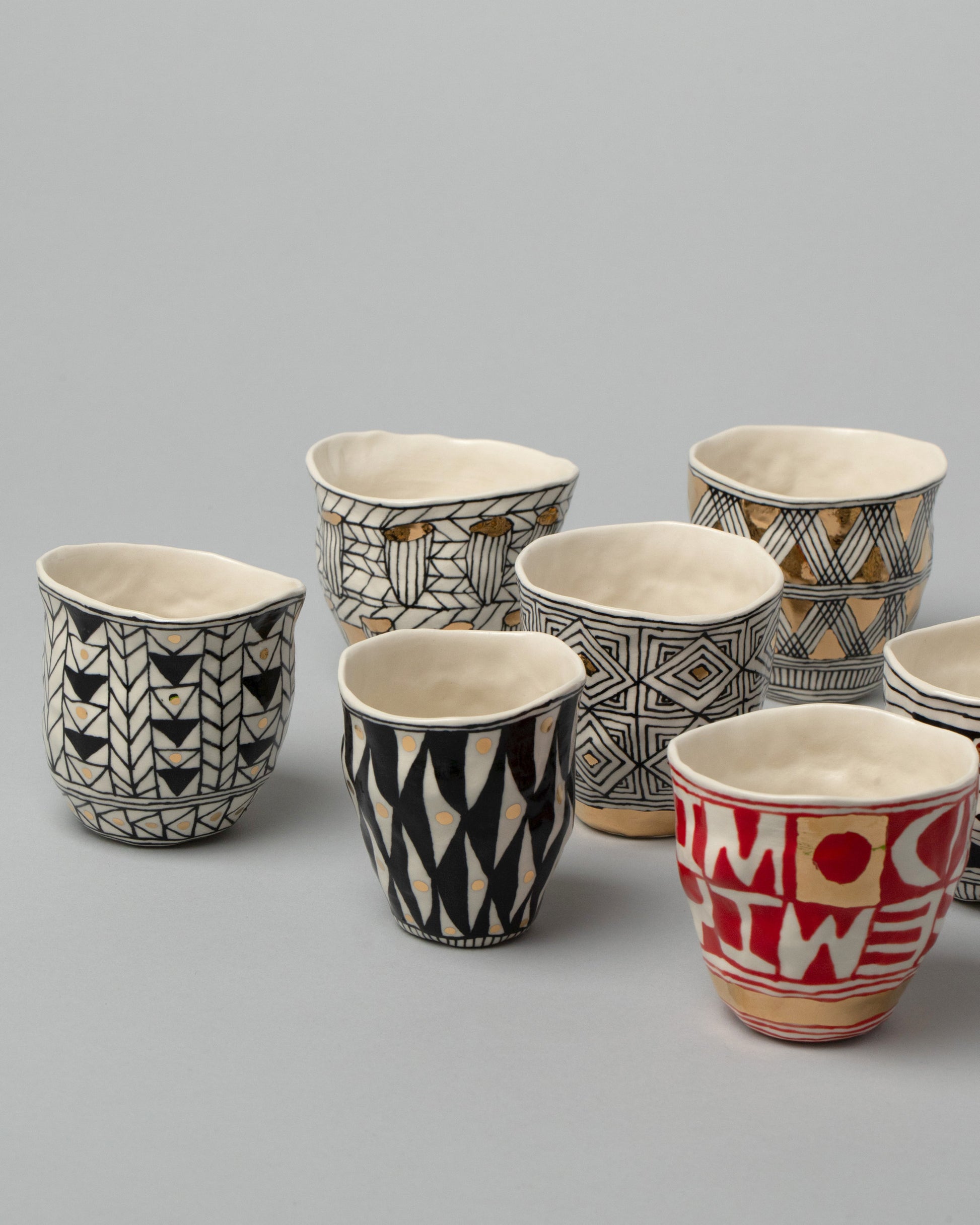 Group of Suzanne Sullivan Geometric Tumblers on light color background.