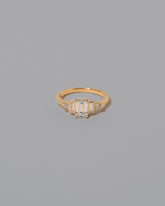 Diamond Assertion Ring on light color background.