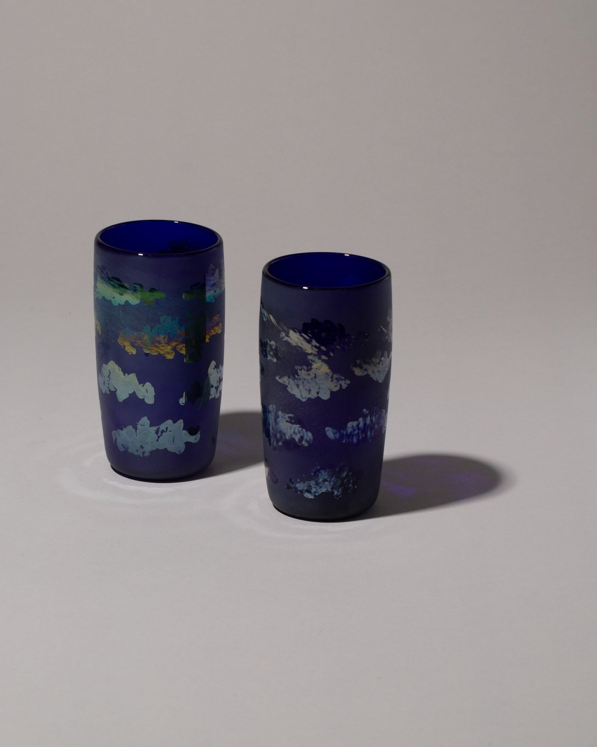 Group of Sirius Glassworks Mirror Cloud Tumblers on on light color background.